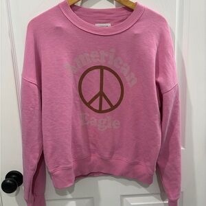 American Eagle Outfitters Pink Crewneck Sweatshirt with Brown Peace Sign